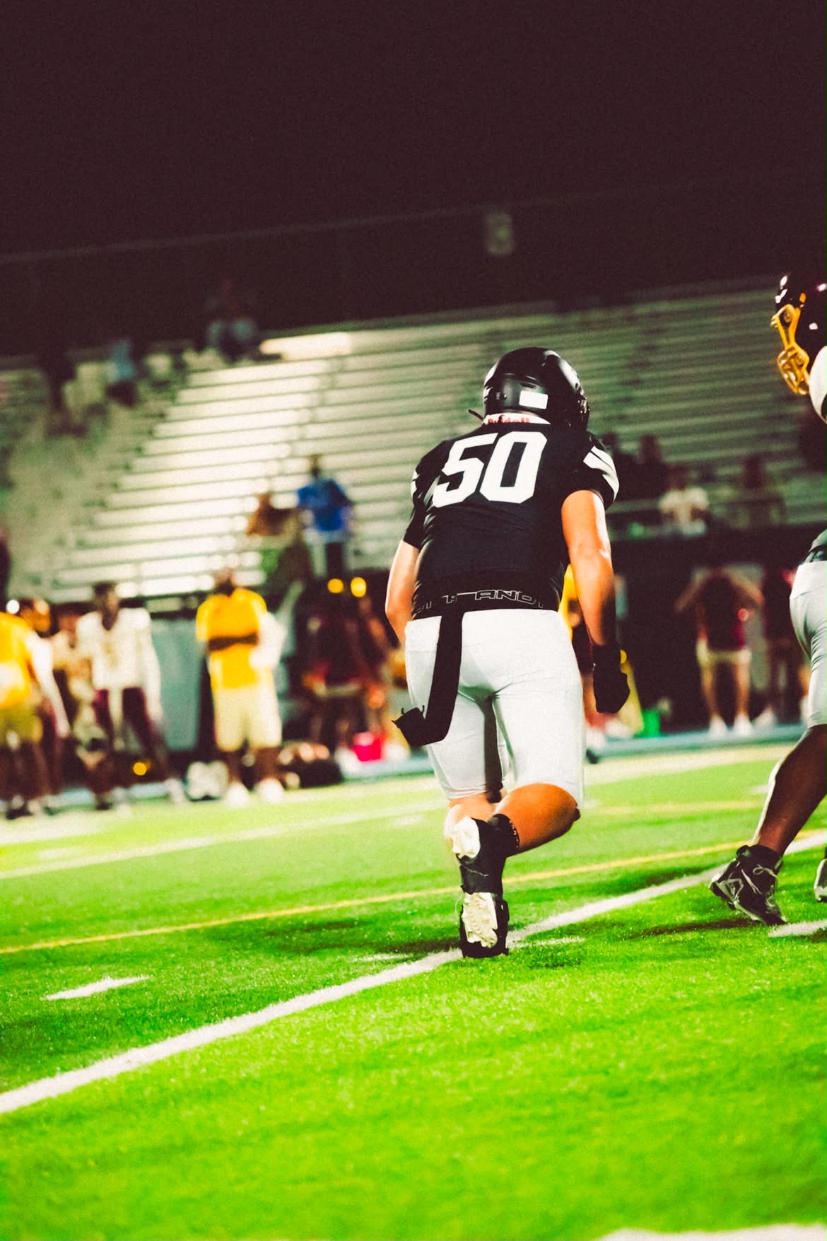 Leonardo Jimenez wearing number 50 during a football game