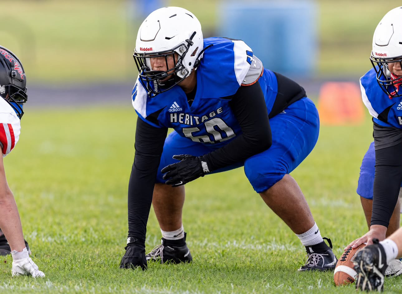 Zaiden Lowery lined up on the football field in his Heritage uniform